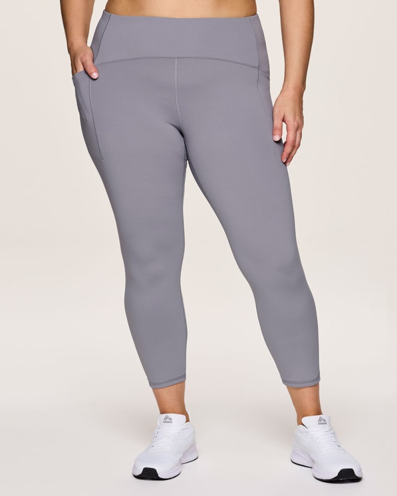 Front of a model wearing a size 3X Plus Power Play Tech Flex 7/8 Legging in Dolphin Grey by RBX Active. | dia_product_style_image_id:348469